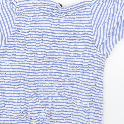 Brand and care label for Evie girls’ blue striped viscose basic blouse, size 9-10, years square neck pullover
