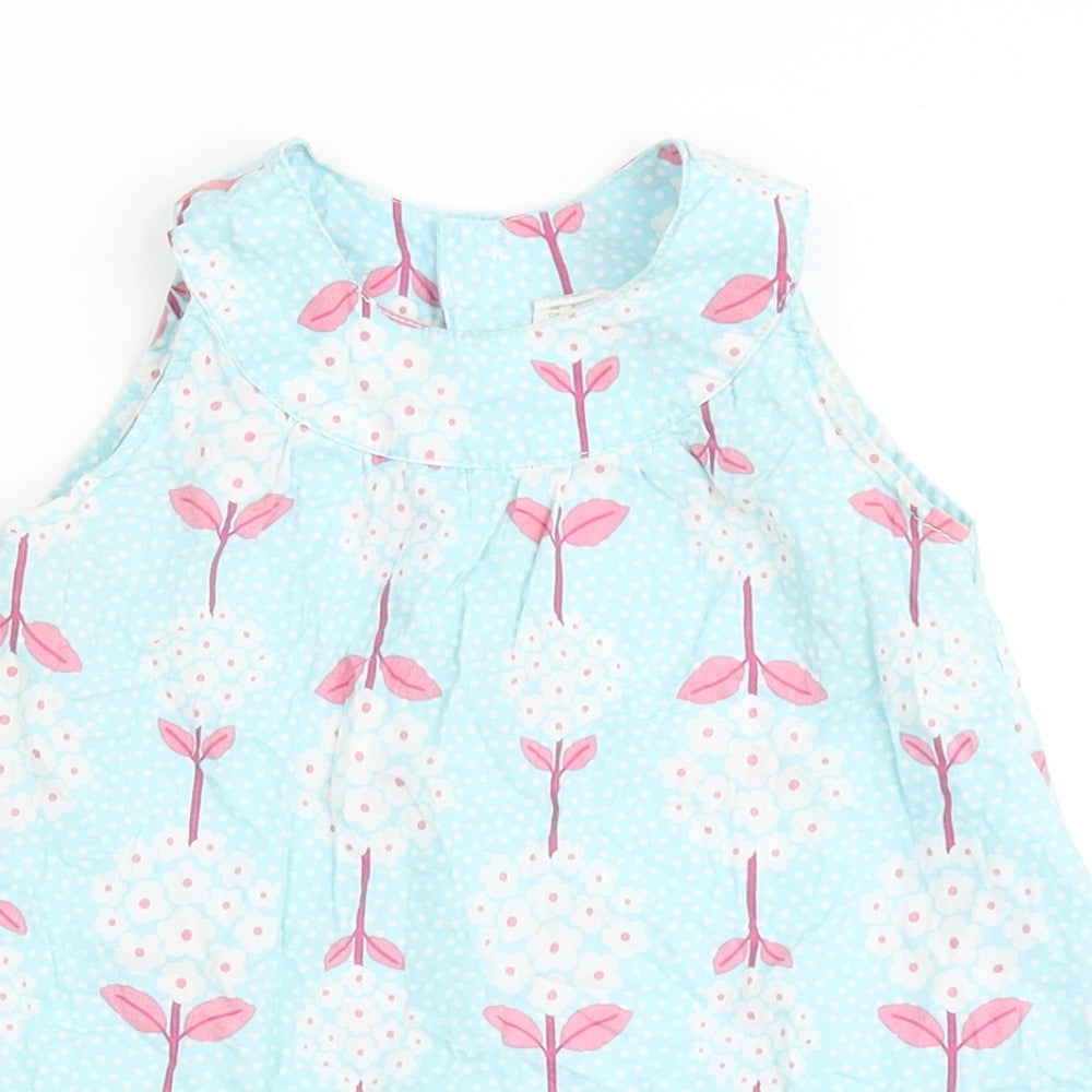 Close-up detail of H&M girls’ blue 100% cotton basic blouse, size 9-12, months round neck pullover