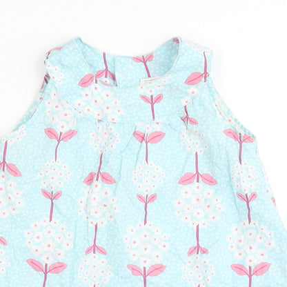 Close-up detail of H&M girls’ blue 100% cotton basic blouse, size 9-12, months round neck pullover