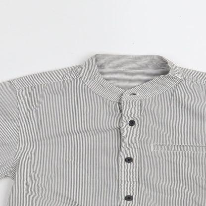Close-up detail of Dunnes boys’ grey striped 100% cotton basic button-up, size 5, years round neck button