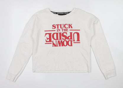 Front view of Stranger Things women’s ivory cotton pullover sweatshirt, size S, - cropped