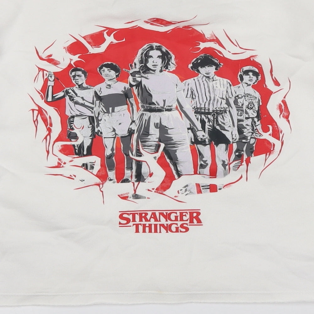 Brand and care label for Stranger Things women’s ivory cotton pullover sweatshirt, size S, - cropped