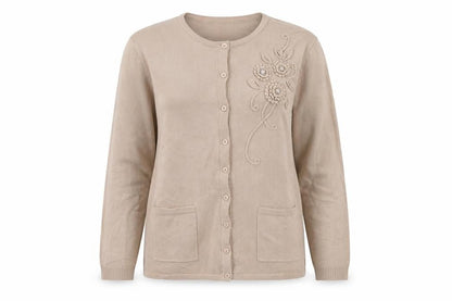 Front view of Reflect women’s beige round neck acrylic cardigan jumper, size M