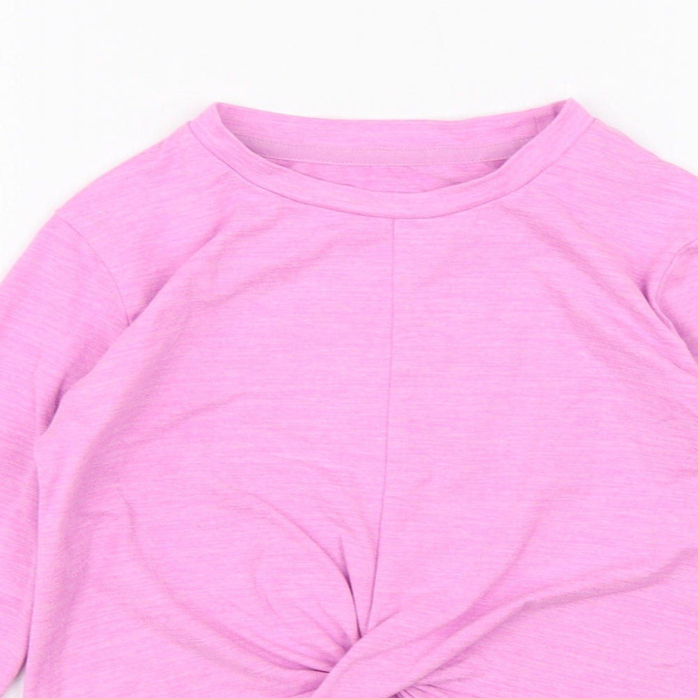 Close-up detail of Dunnes girls’ purple polyester basic t-shirt, size 6-7, years round neck pullover