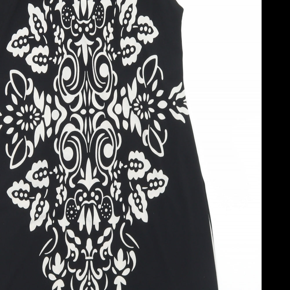 Brand and care label for PussyCat women’s black polyester tunic blouse, size S, round neck