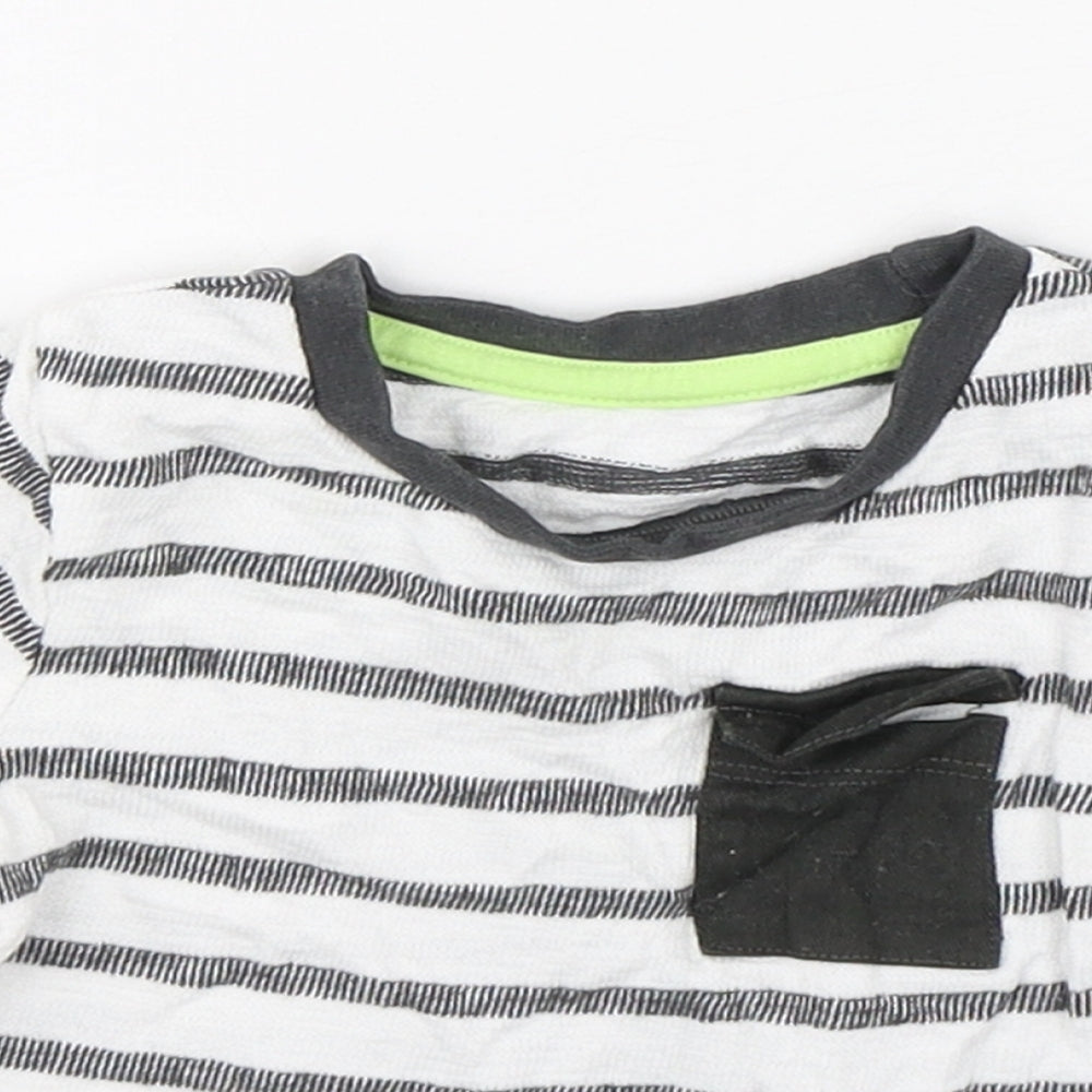 Close-up detail of Dunnes boys’ multicoloured striped cotton basic t-shirt, size 6-9, months round neck pullover
