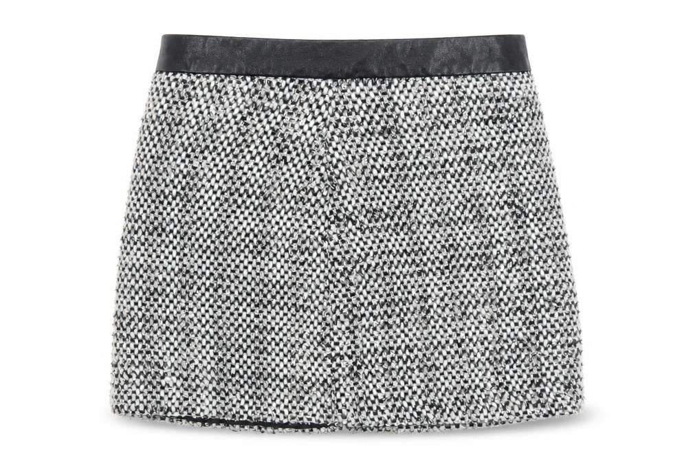 Front view of Dunnes women’s black polyester a-line skirt, size UK 25, in zip