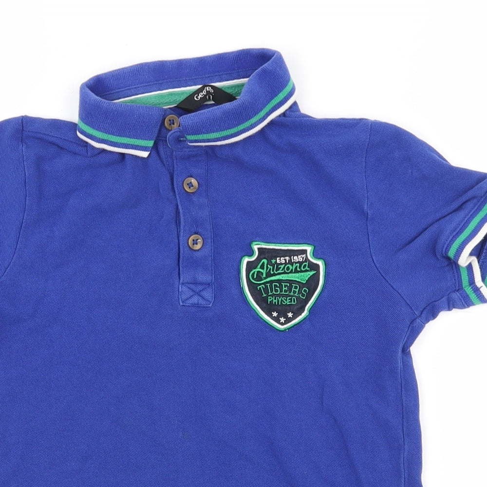 Close-up detail of George boys’ blue 100% cotton pullover polo, size 6-7, years collared button