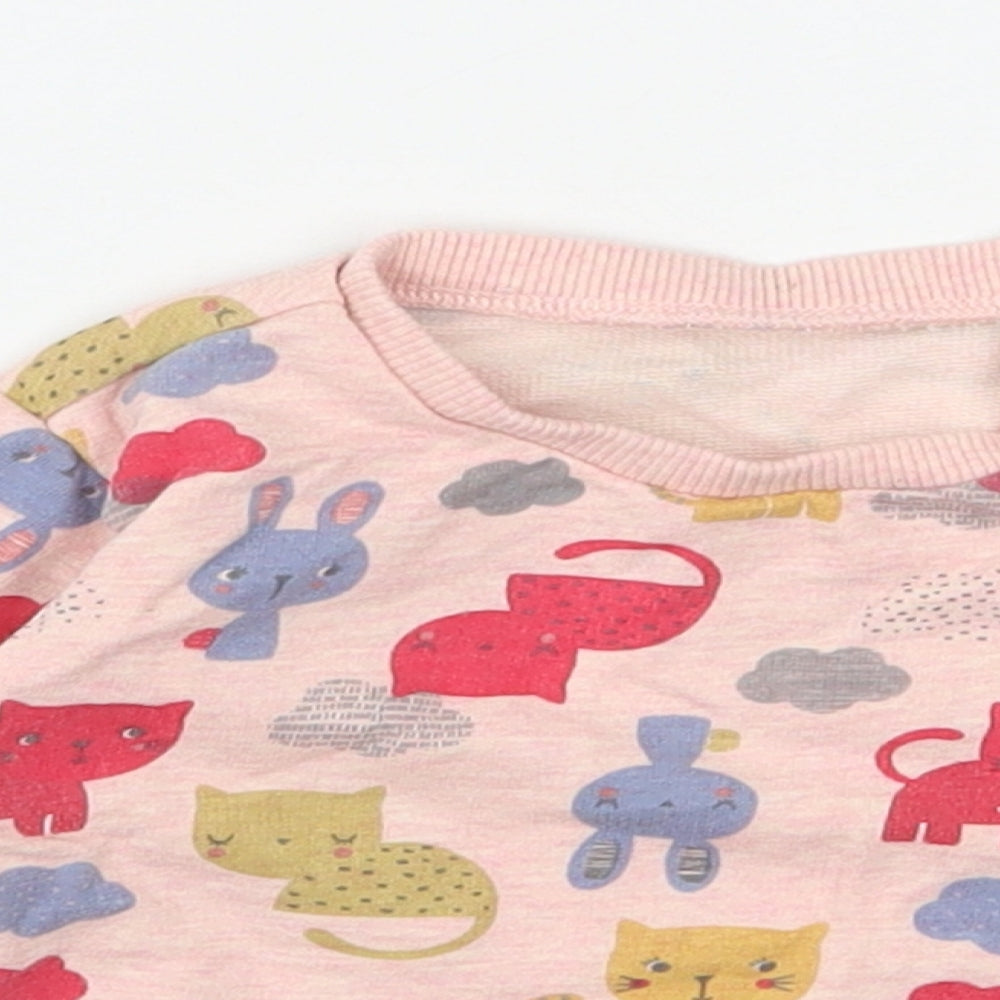Close-up detail of Nutmeg girls’ pink 100% cotton basic casual, size 6-9, months round neck pullover