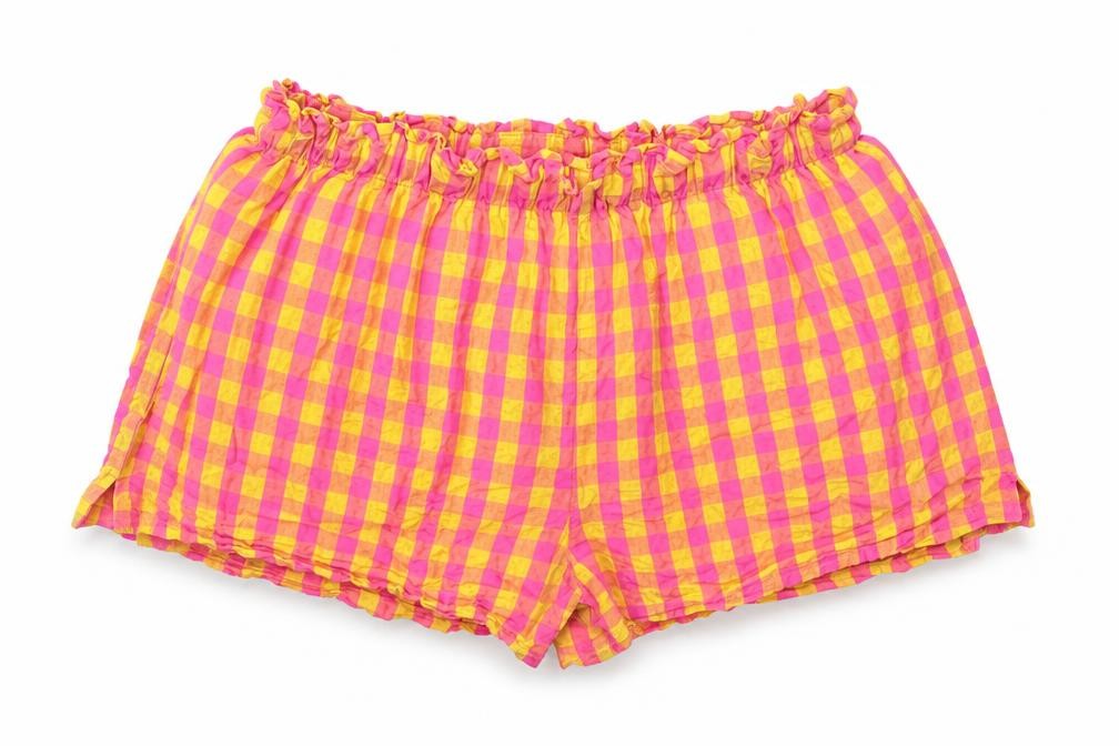 Front view of Next girls’ pink check 100% cotton skimmer shorts, size 11, years regular