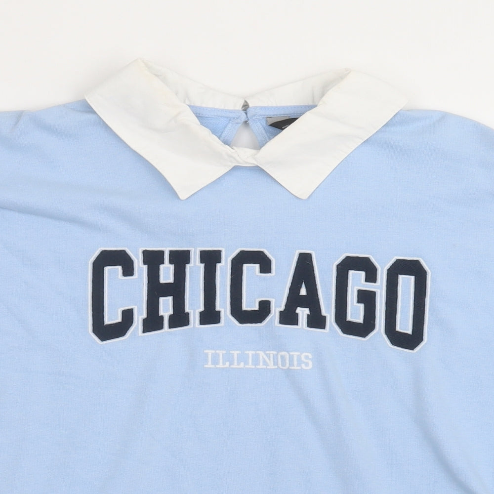 Close-up detail of F&F women’s blue cotton pullover sweatshirt, size UK 12, button - chicago