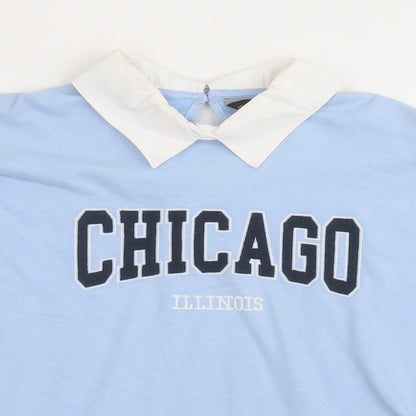 Close-up detail of F&F women’s blue cotton pullover sweatshirt, size UK 12, button - chicago