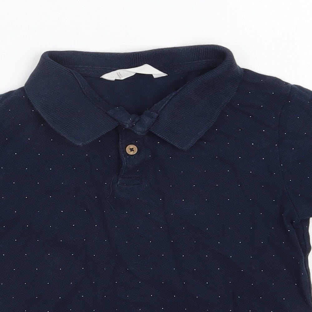 Close-up detail of Mango boys’ blue spotted cotton basic polo, size 6, years collared button