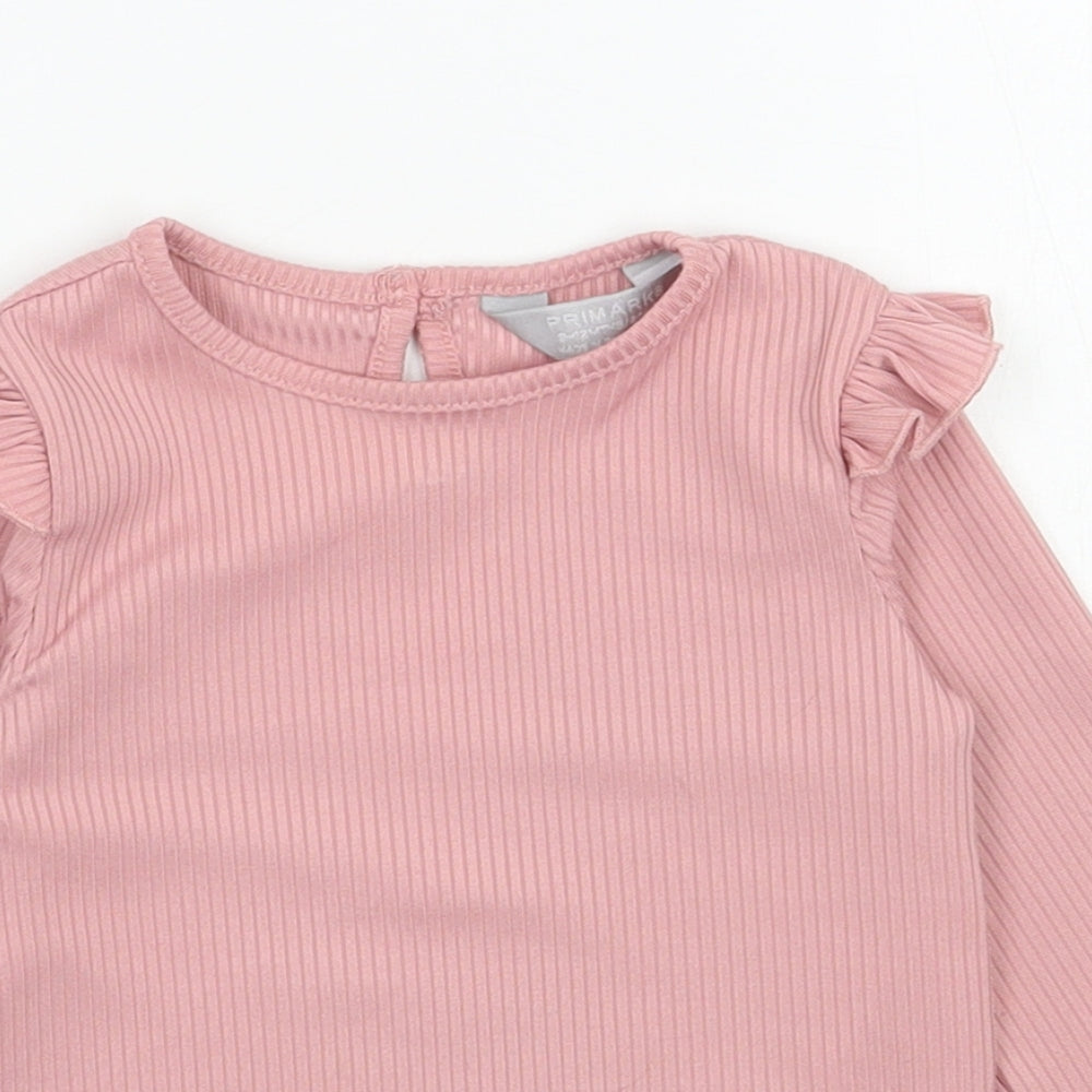 Close-up detail of Primark girls’ pink polyester pullover casual, size 9-12, months round neck pullover