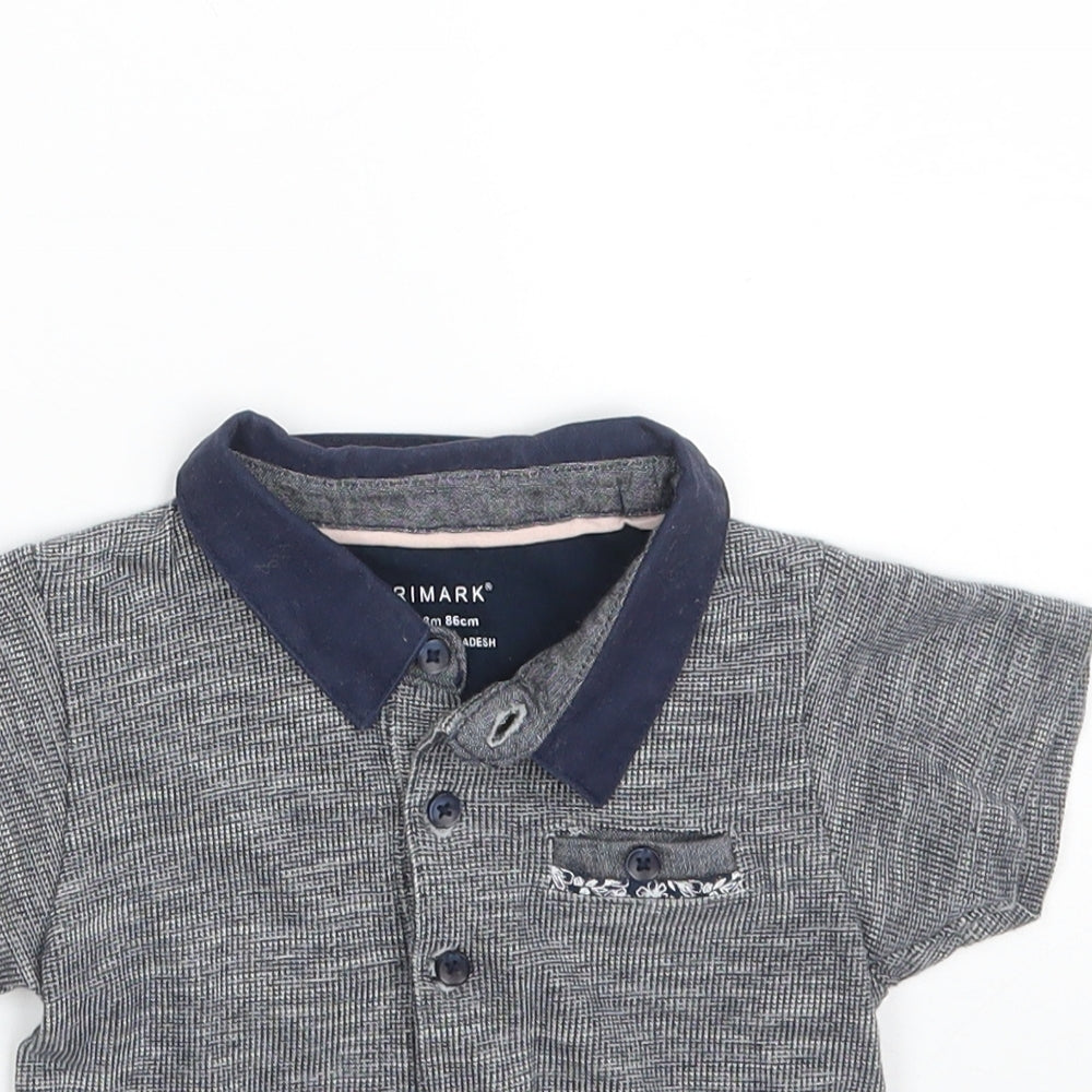 Close-up detail of Primark boys’ grey 100% cotton pullover polo, size 12-18, months collared button
