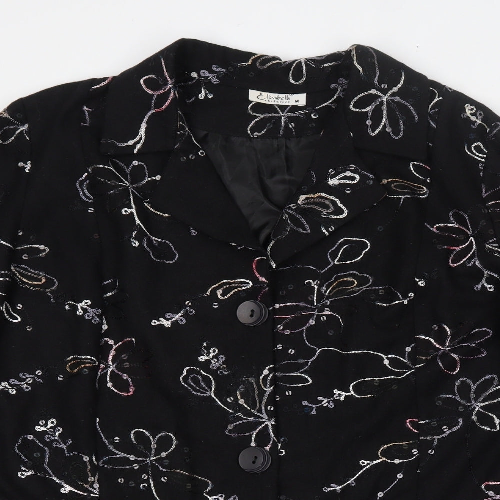 Close-up detail of Exclusive women’s black floral jacket blazer, size M, button