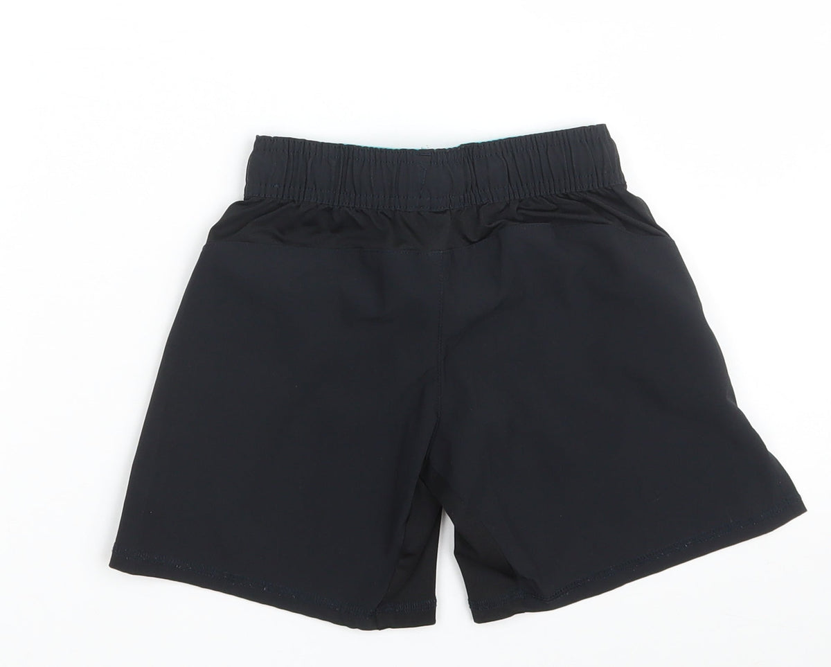Back view of Domyos boys’ black polyester sweat shorts, size 5, years regular