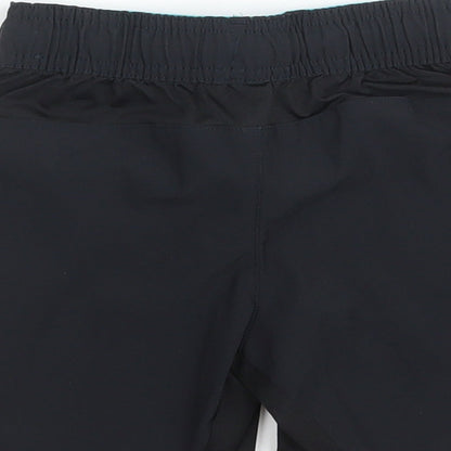 Brand and care label for Domyos boys’ black polyester sweat shorts, size 5, years regular