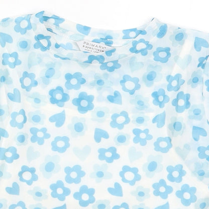 Close-up detail of Primark girls’ blue floral polyester basic t-shirt, size 8-9, years crew neck pullover