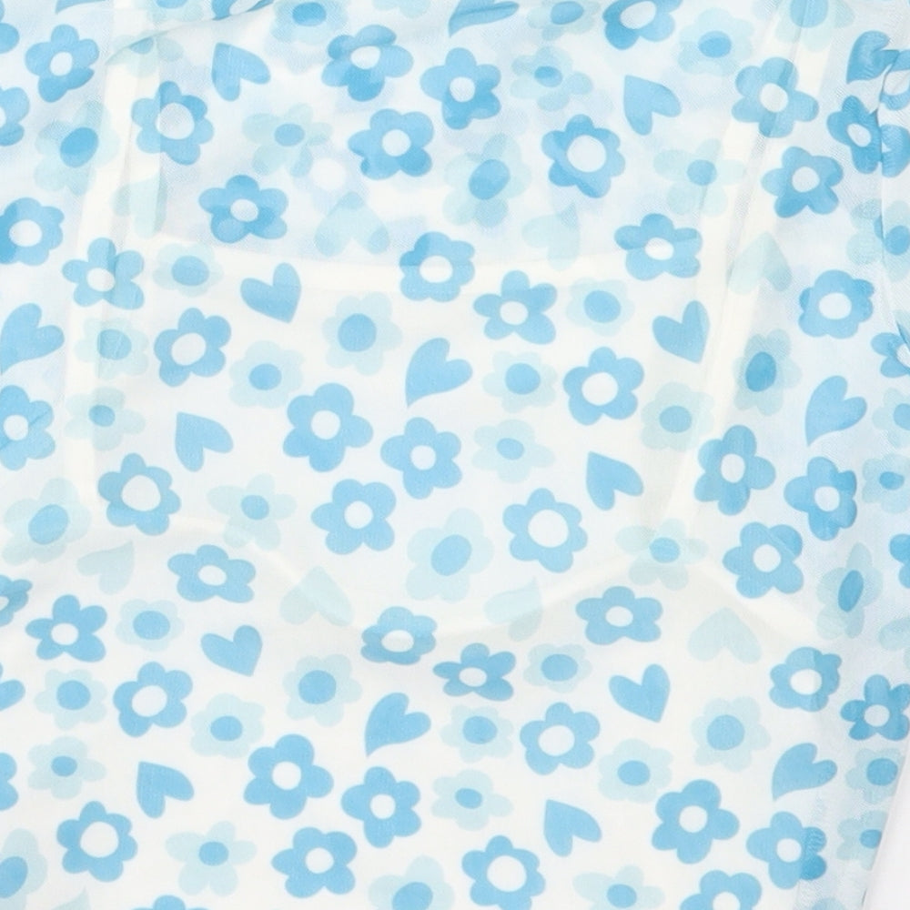 Brand and care label for Primark girls’ blue floral polyester basic t-shirt, size 8-9, years crew neck pullover
