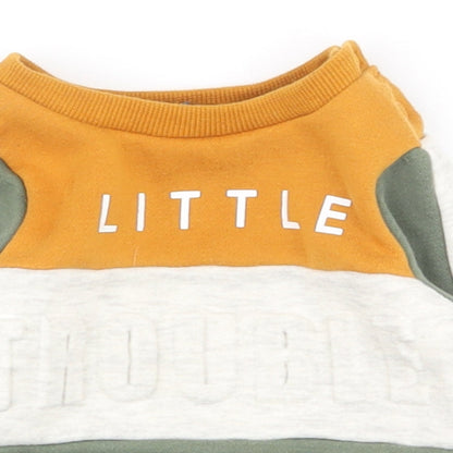 Close-up detail of Primark boys’ multicoloured striped polyester jumper, size 0-3, months snap
