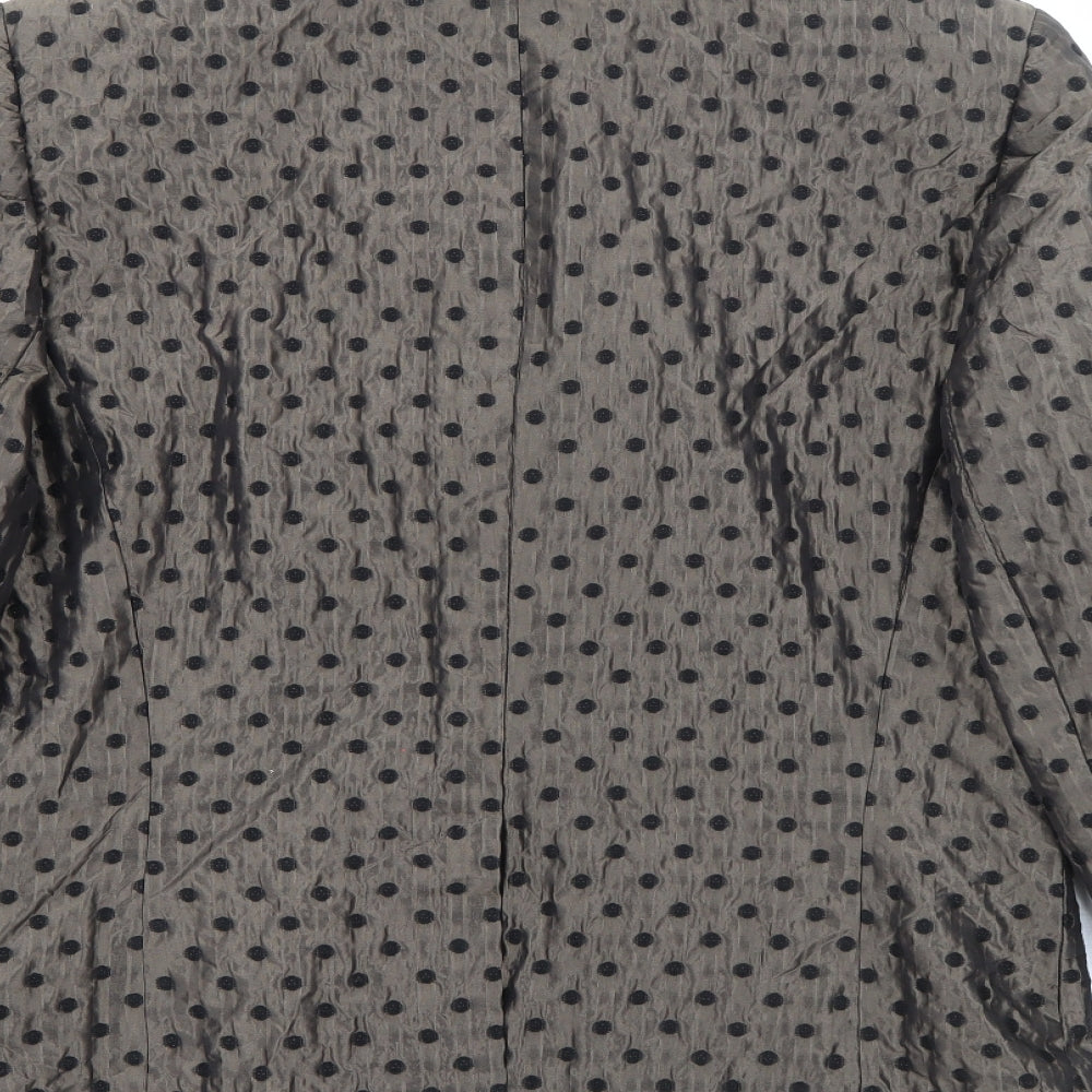 Brand and care label for TUZZI women’s brown polka dot acrylic jacket blazer, size UK 14