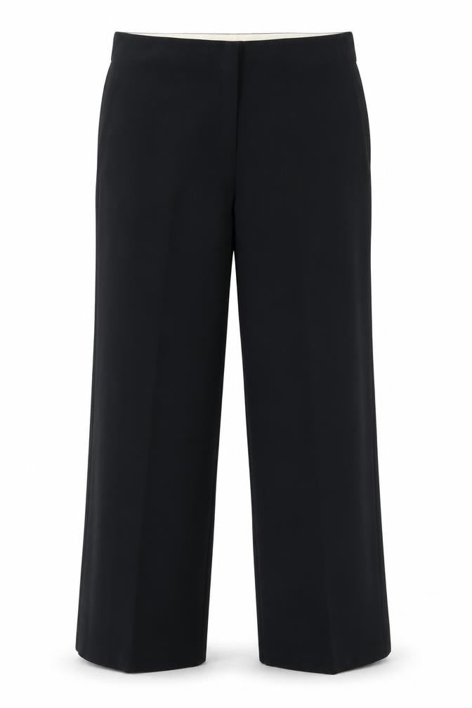 Front view of Marks & Spencer women’s black polyester dress pants trousers, size UK 38, in, 28-inch leg regular zip