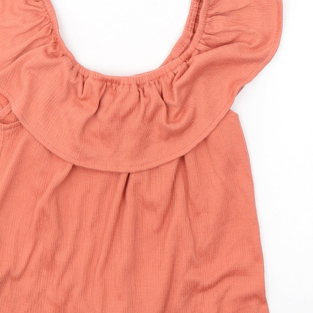 Brand and care label for Primark girls’ orange polyester basic blouse, size 9-10, years round neck pullover - knot detail