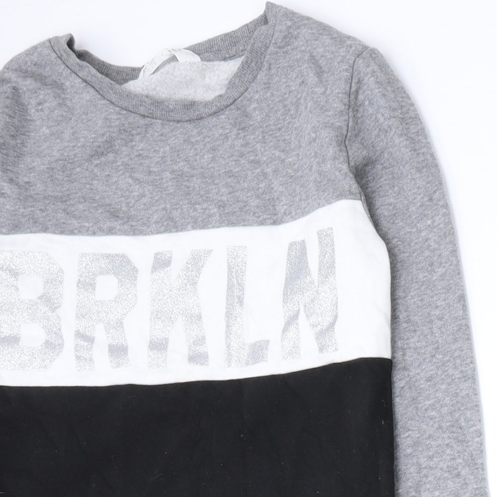 Close-up detail of H&M girls’ multicoloured colourblock cotton pullover sweatshirt, size 9-10, years pullover