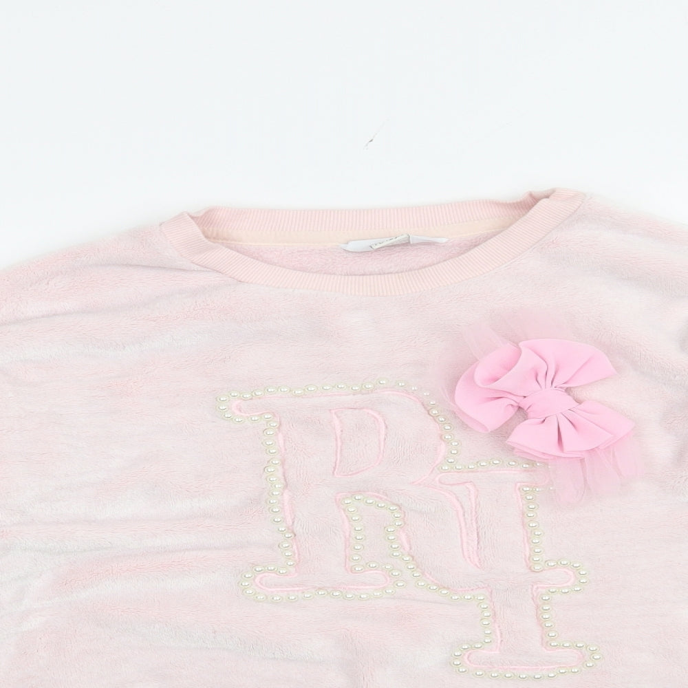 Close-up detail of River Island girls’ pink polyester pullover sweatshirt, size 11-12, years pullover