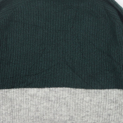 Brand and care label for Envii women’s green round neck acrylic jumper, size S