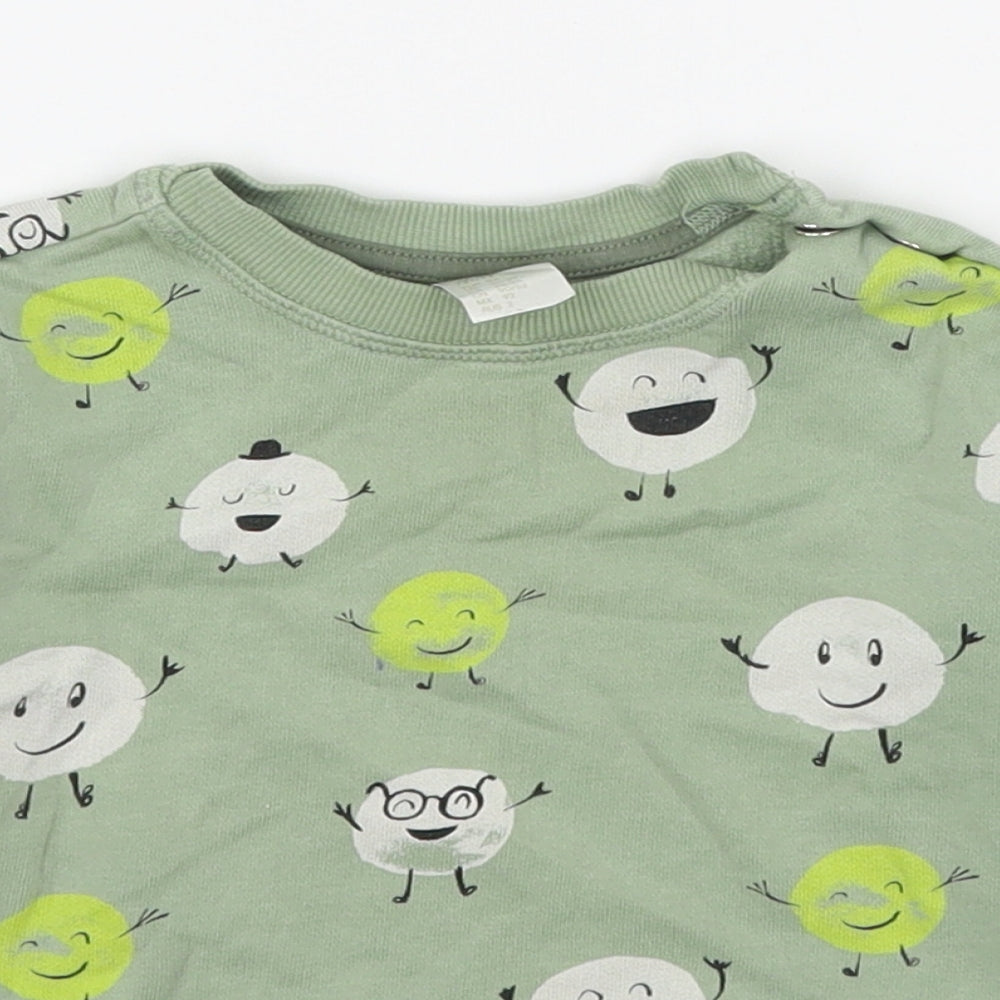 Close-up detail of H&M boys’ green geometric cotton pullover sweatshirt, size 2, years pullover