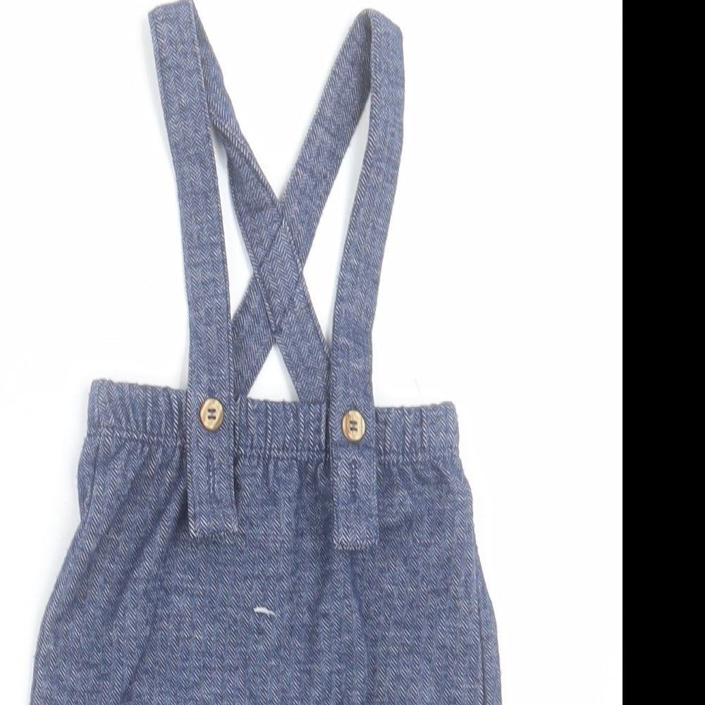 Close-up detail of George boys’ blue polyester capri trousers, size 0-3, months button - cross back