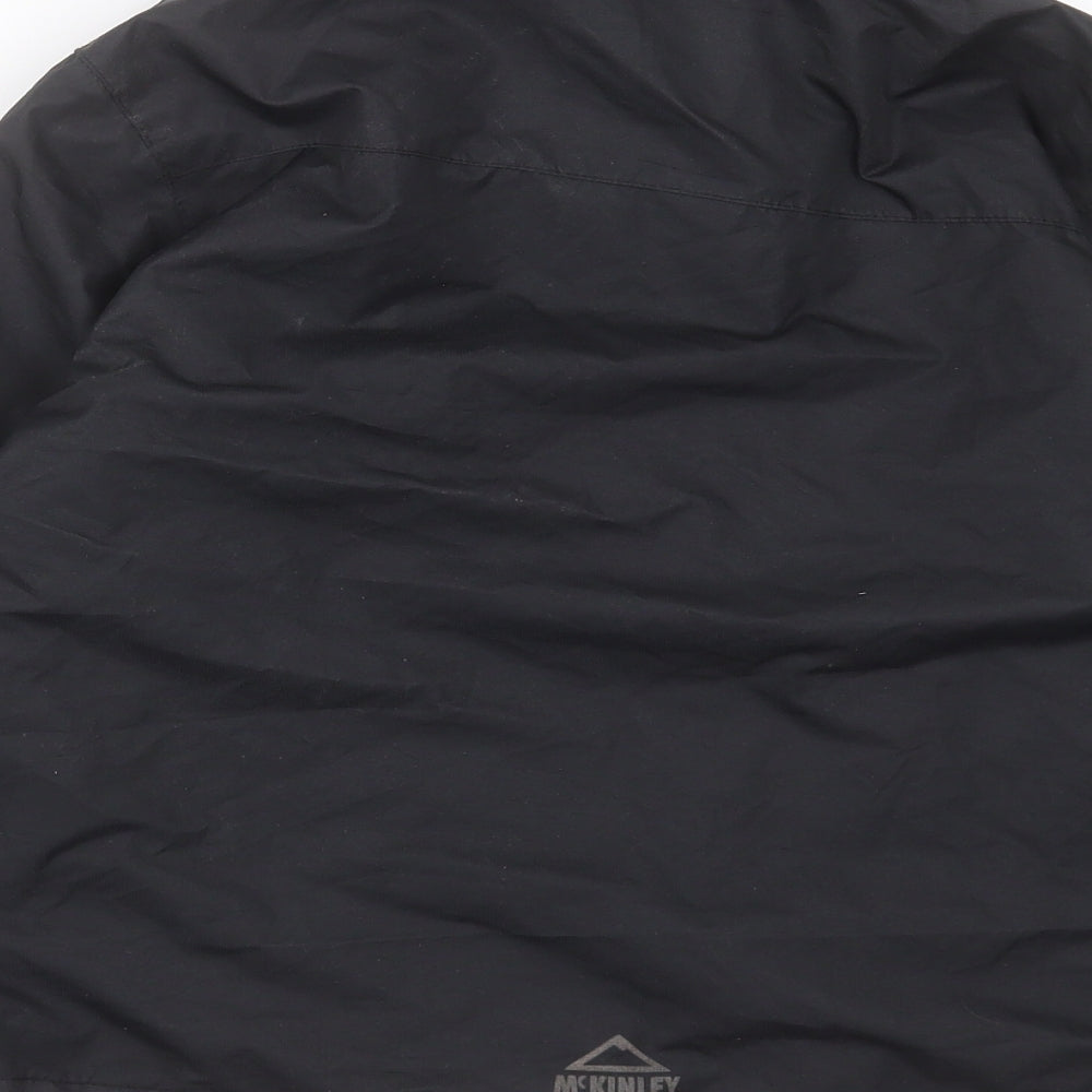 Brand and care label for McKINLEY boys’ black jacket, size 8, years zip