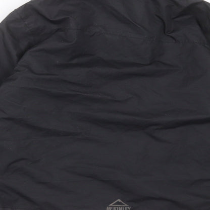 Brand and care label for McKINLEY boys’ black jacket, size 8, years zip