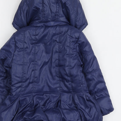 Brand and care label for Blukids girls’ blue jacket, size 18, months