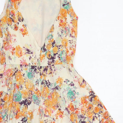 Love Womens Orange Floral Polyester Romper One-Piece Size M Pullover - Open Back