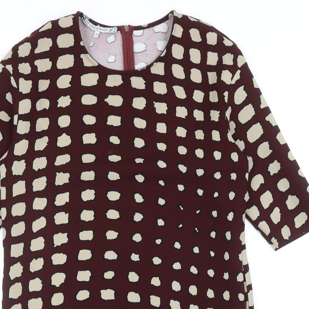 Close-up detail of La Fee Maraboutee women’s red geometric polyester a-line, size UK 10, round neck zip