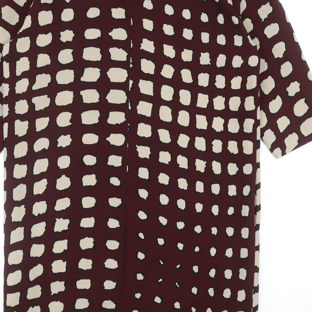 Brand and care label for La Fee Maraboutee women’s red geometric polyester a-line, size UK 10, round neck zip