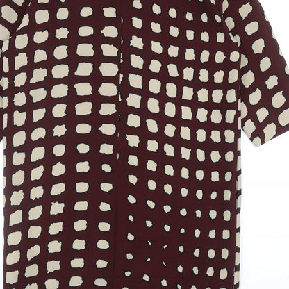 Brand and care label for La Fee Maraboutee women’s red geometric polyester a-line, size UK 10, round neck zip