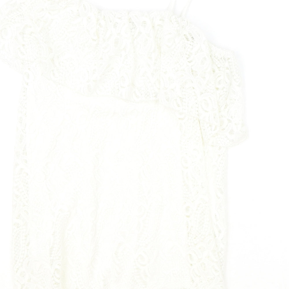Brand and care label for River Island girls’ ivory polyester basic blouse, size 11-12, years off the shoulder pullover