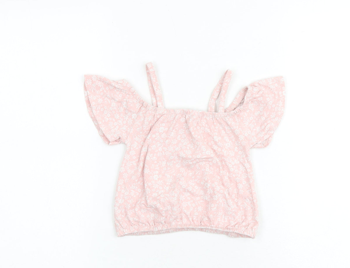 Back view of Btween girls’ pink floral cotton basic blouse, size 6, years round neck pullover - cold shoulder