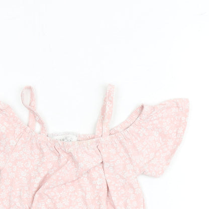 Close-up detail of Btween girls’ pink floral cotton basic blouse, size 6, years round neck pullover - cold shoulder