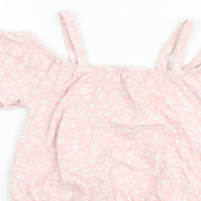 Brand and care label for Btween girls’ pink floral cotton basic blouse, size 6, years round neck pullover - cold shoulder
