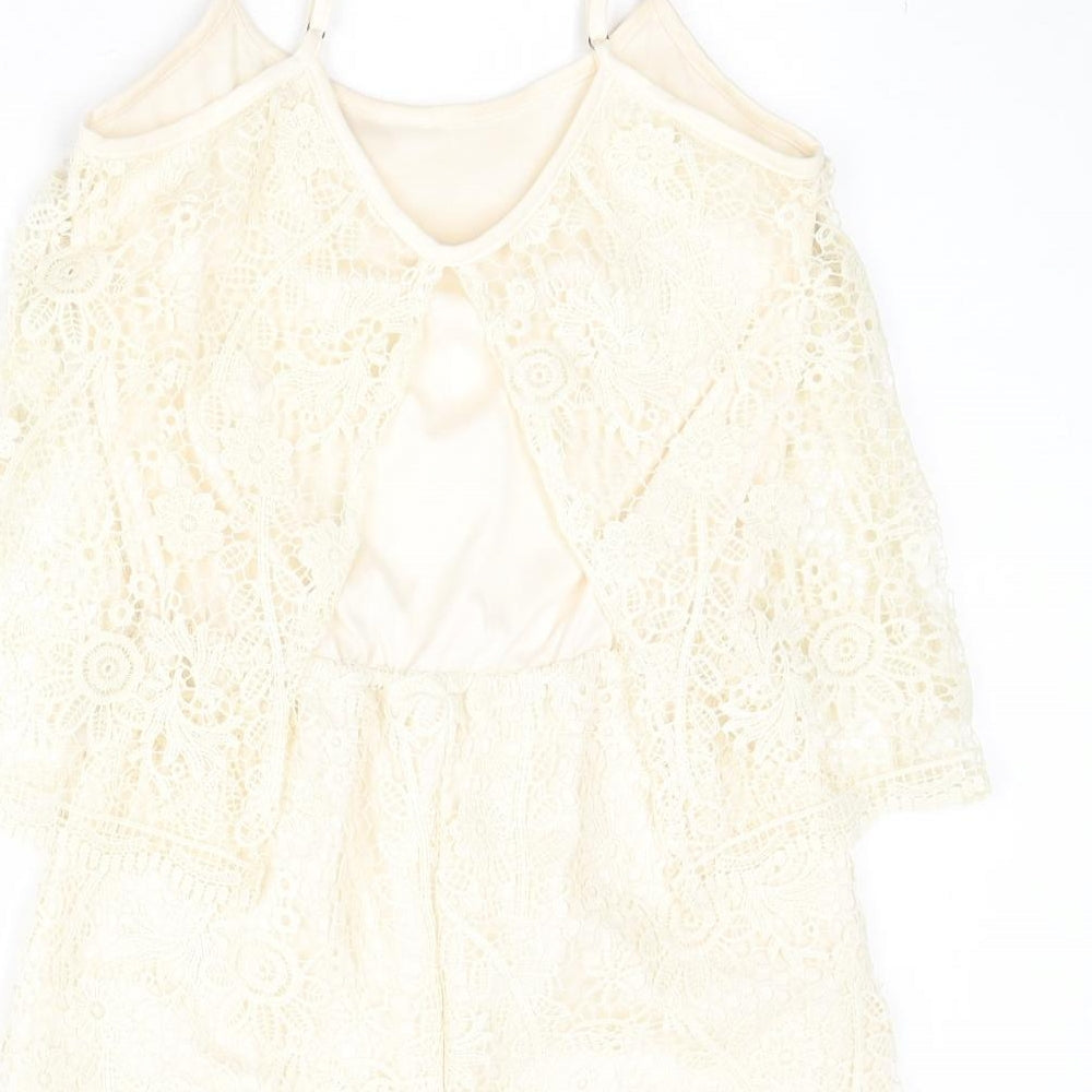 Brand and care label for Rebel women’s beige floral polyester playsuit one-piece, size M, pullover