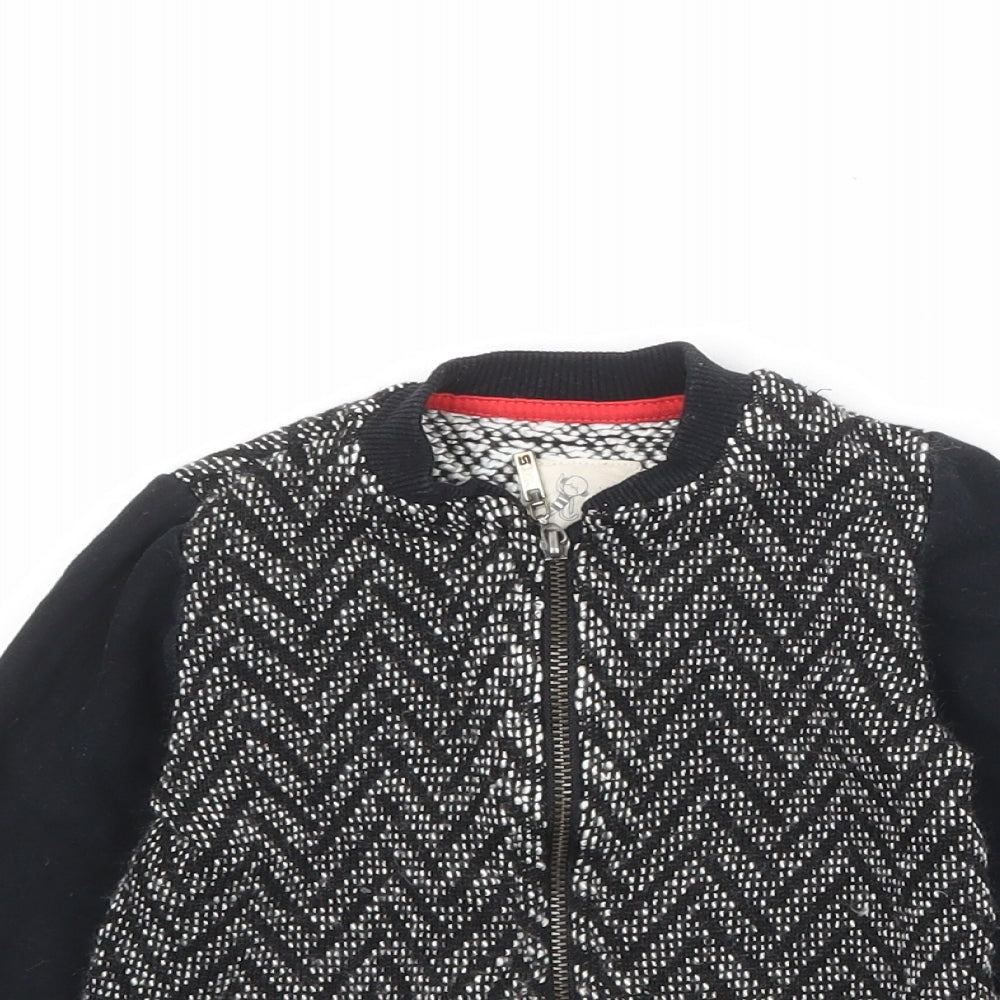Close-up detail of River Island boys’ black geometric jacket, size 2-3, years zip