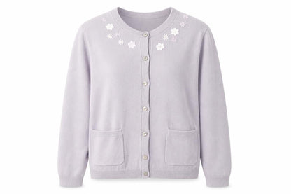 Front view of Cotswold women’s purple round neck cotton cardigan jumper, size S, - flower detail