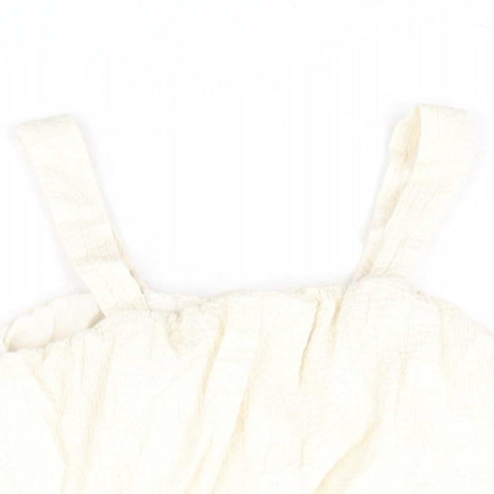 Close-up detail of Zara girls’ ivory polyester cropped blouse, size 10, years square neck pullover