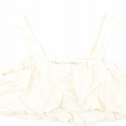 Brand and care label for Zara girls’ ivory polyester cropped blouse, size 10, years square neck pullover