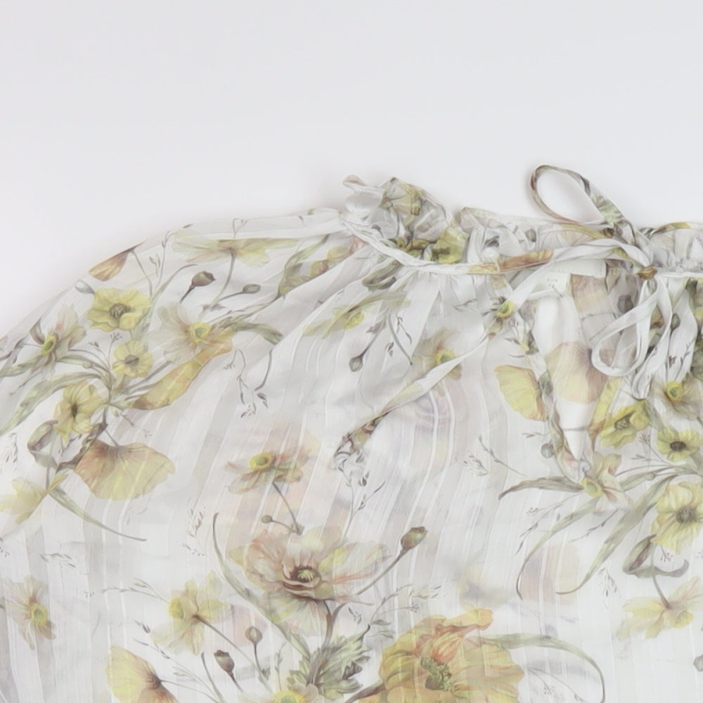 Close-up detail of H7&M women’s white floral polyester basic blouse, size UK 6, mock neck